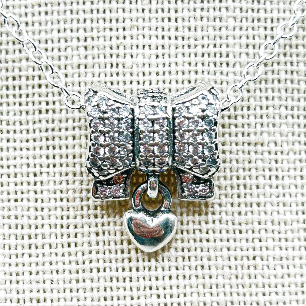 NWOT Sterling silver pave bow with dangling heart charm pendant necklace 18”